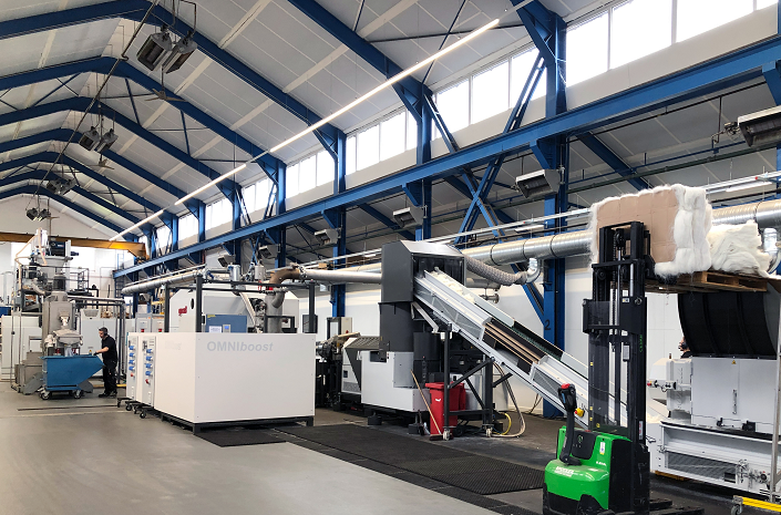Omniboost di Gneuss: sistema di riciclo di rifiuti di fibre in PET